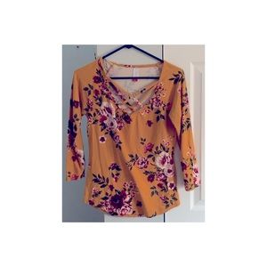 Floral yellow shirt.